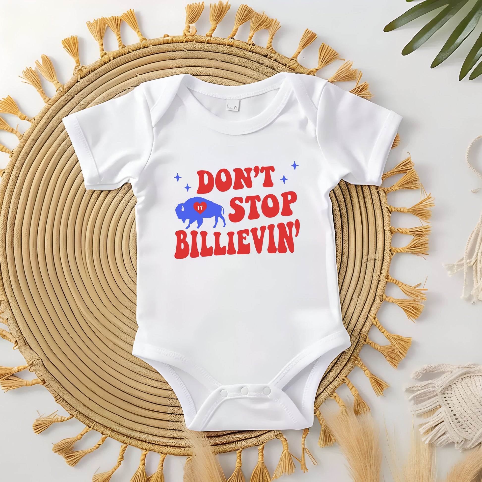 a baby bodysuit that says, don't stop believing