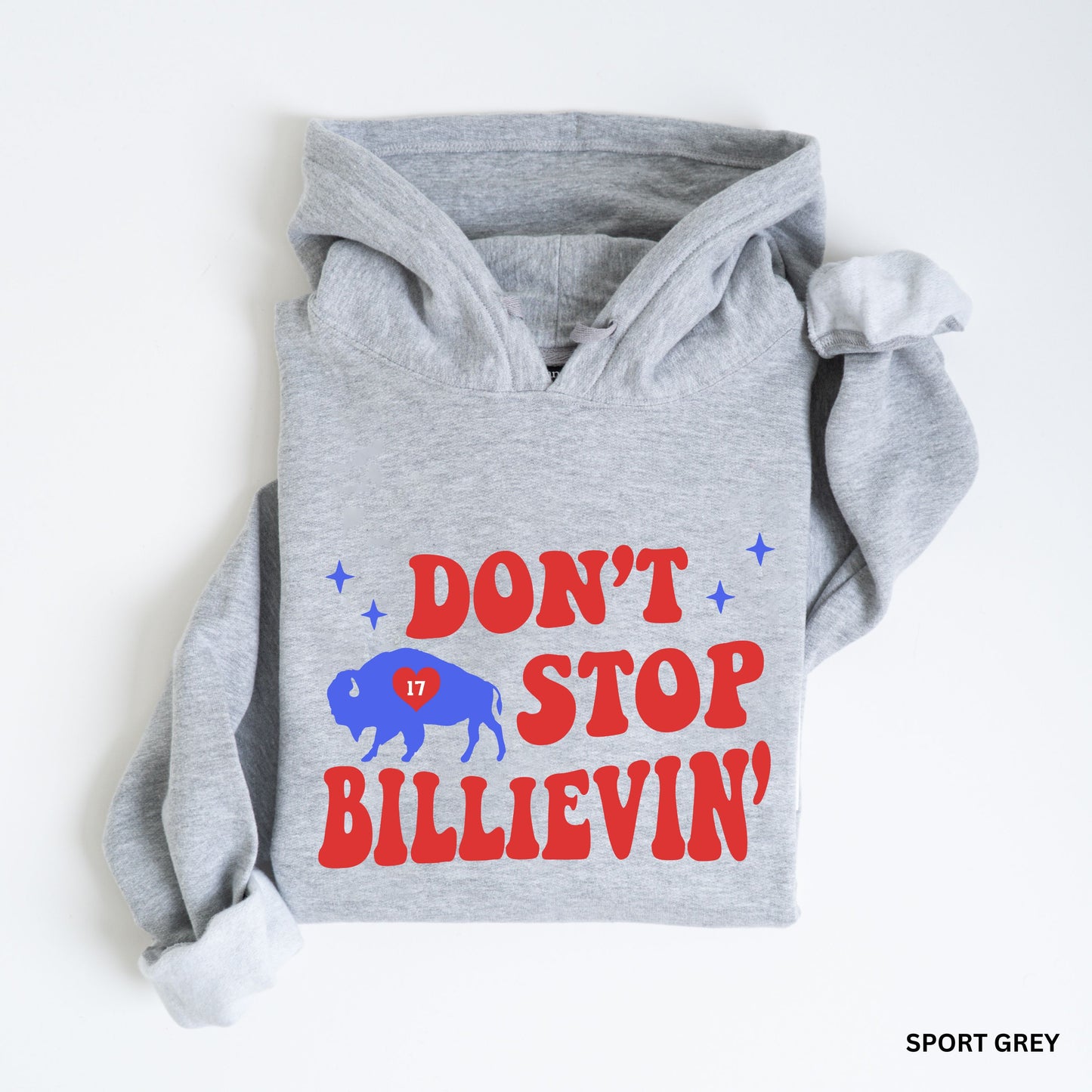 a dog wearing a hoodie that says don't stop believing