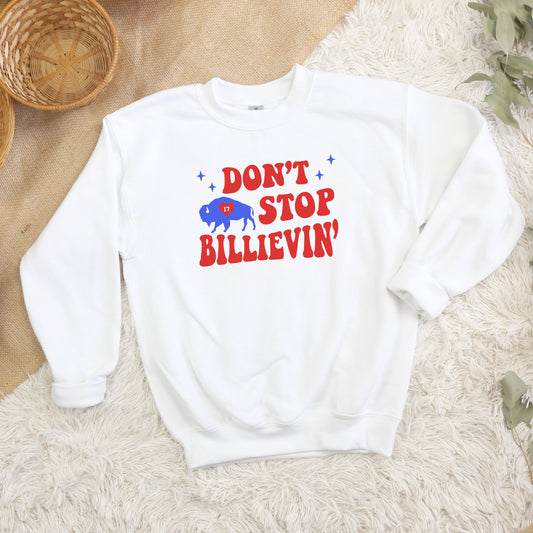 a white sweatshirt with the words don't stop and a red white and blue