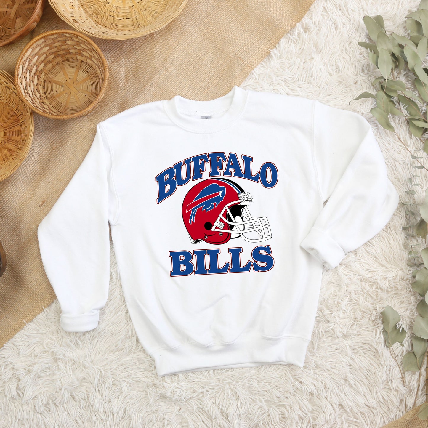 a buffalo bills sweatshirt sitting on top of a rug