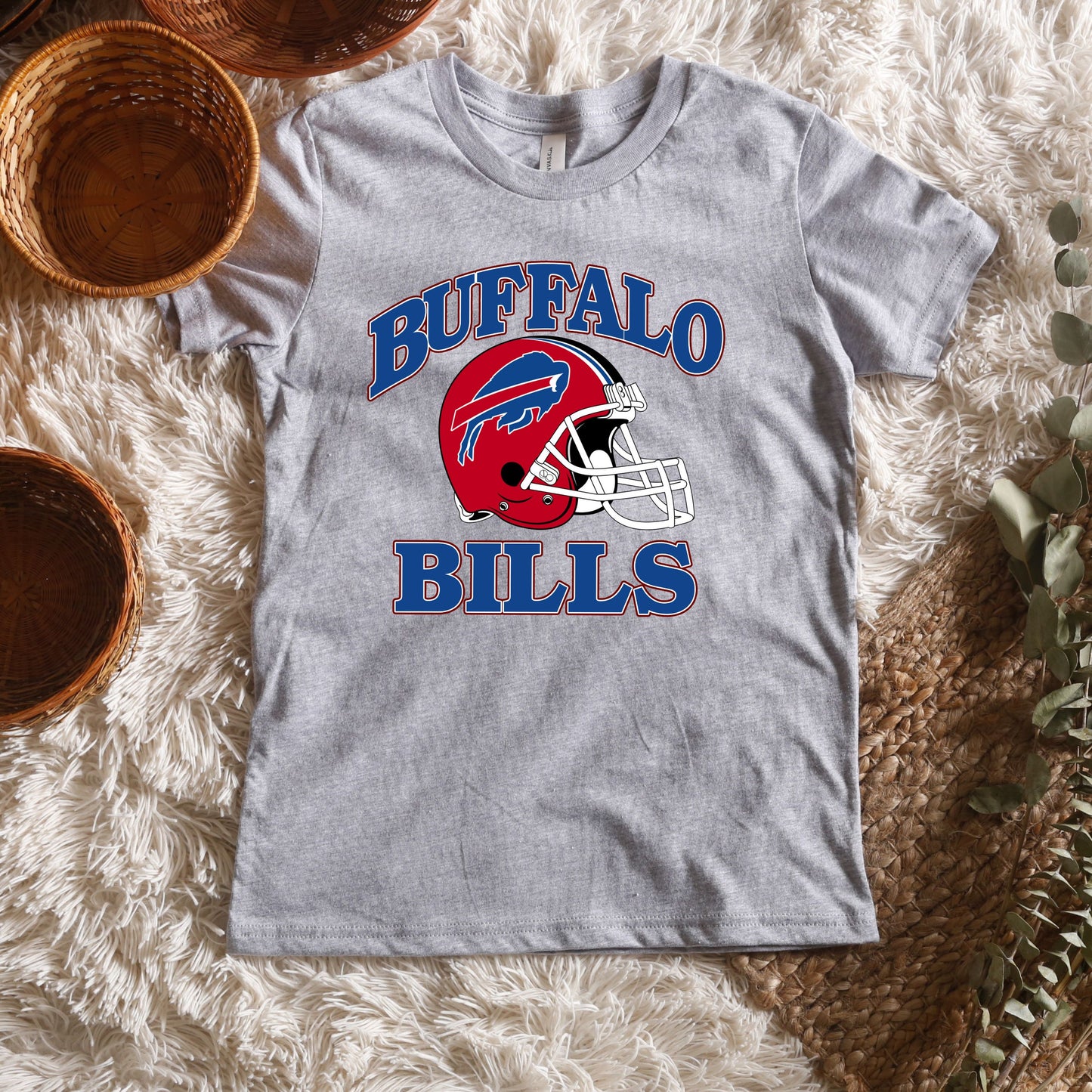 a buffalo bills shirt sitting on top of a white rug