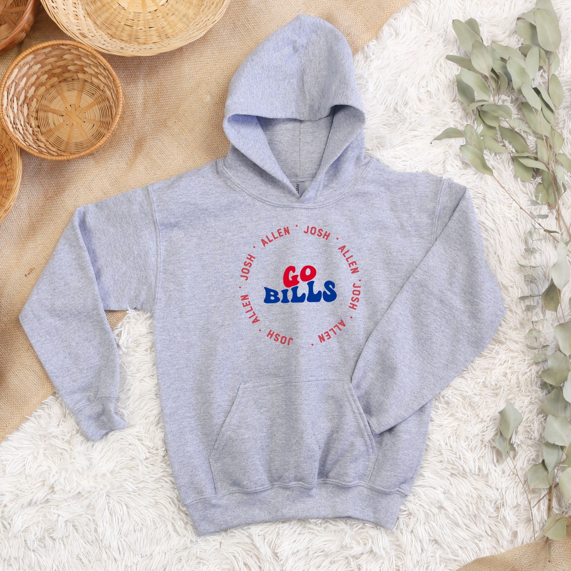 a blue hoodie with a red, white, and blue logo on it